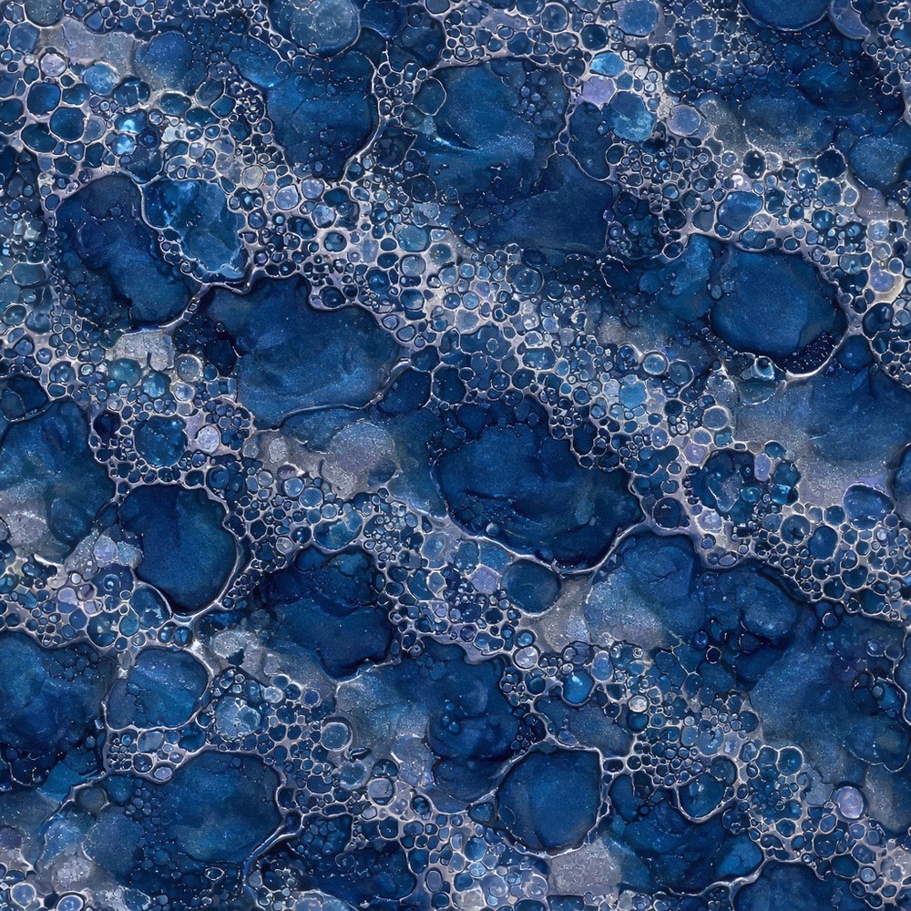 Sample of spattering metallic epoxy with blue cellular lace patterns